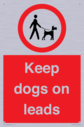dogs-on-lead-symbol-with-black-text-on-white-background~